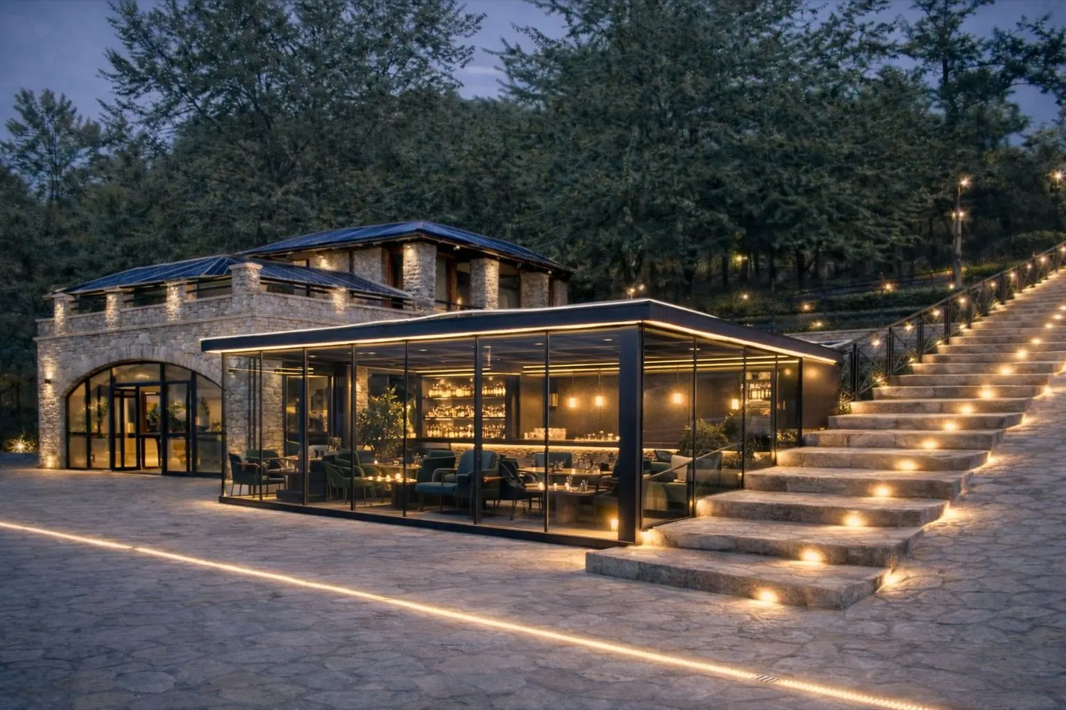 Veranda vetrata del ristorante centrale con luce architetturale e continuità indoor/outdoor